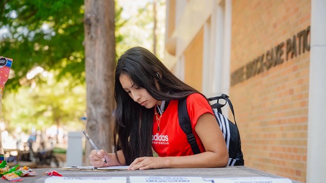 Makayla Ortega, 19, a student at University of Texas at Arlington, registers to vote at the UTA campus on Sept. 10, 2024.