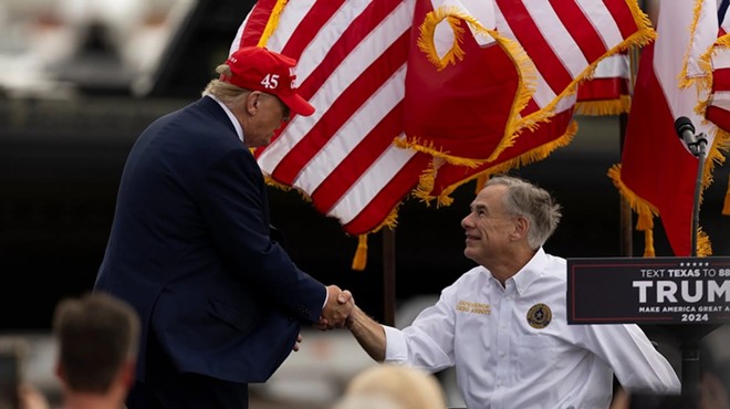 Former President Donald Trump greets and shakes hands with Gov. Greg Abbott at the South Texas International Airport in Edinburg, on Nov. 19, 2023, after the governor announced that he was endorsing Trump.