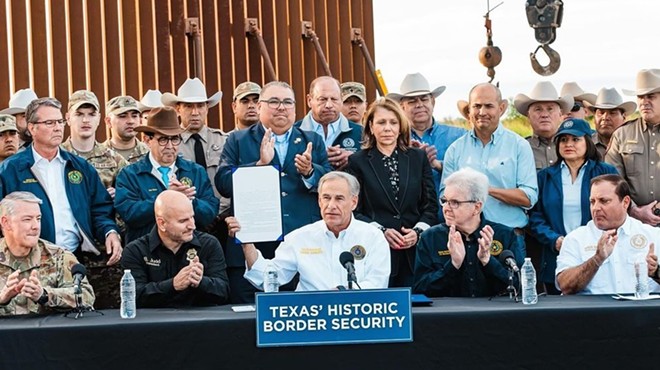 Texas Gov. Greg Abbott shows off a new immigration bill during signing event in South Texas.