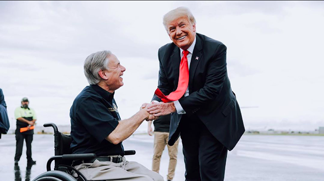Gov. Greg Abbott (left) shakes hands with former President Donald Trump during a border photo op in late June.