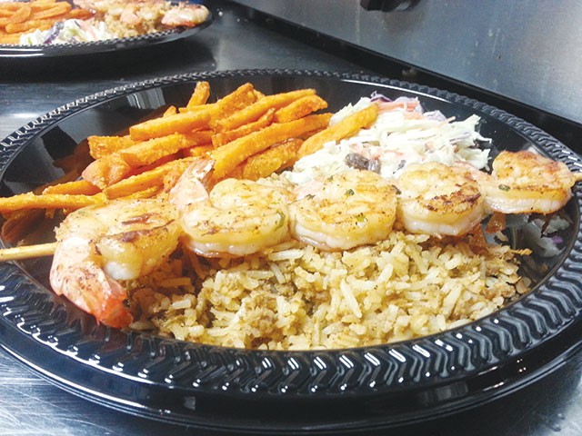 Heartwarming dirty rice and grilled shrimp - Courtesy photo