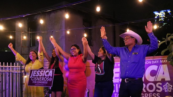 Congressional candidate Jessica Cisneros joins her family for a victory pose.