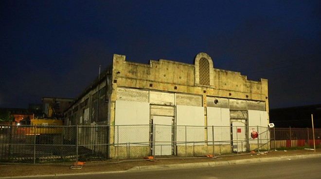 The Whitt building as it stands facing West Houston Street on the night of May 30.