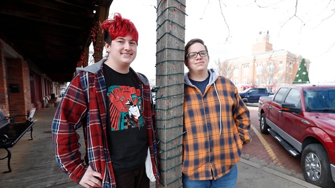 Marcus Stovall and Bear Bright stand on the sidewalk across the street from the courthouse on Dec. 9, 2023 in Canyon.