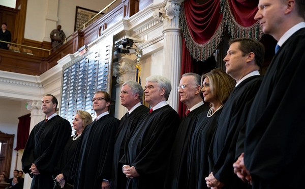 Texas Supreme Court Justice John Devine, far left, with fellow judges on the House floor in Austin in 2013.