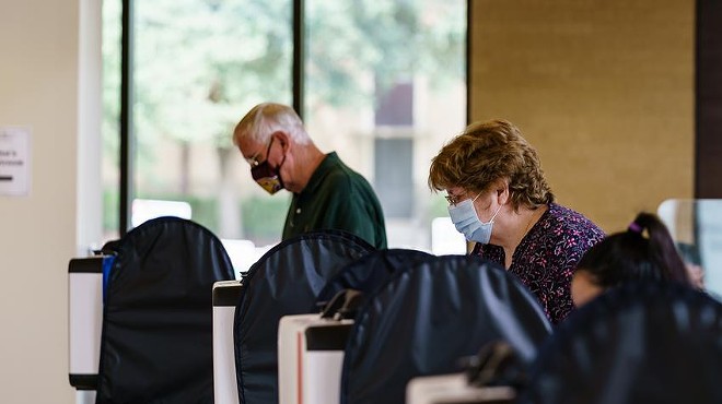Voters cast their ballots at the Performing Arts Center at Texas State University in San Marcos.