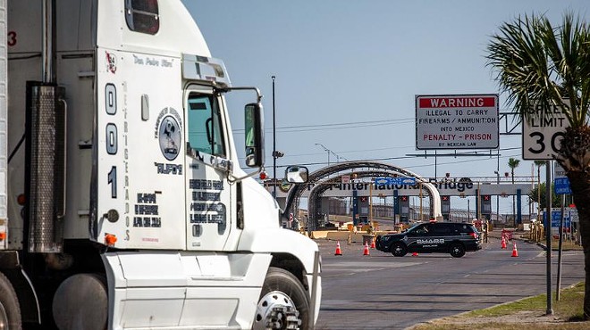 A commercial truck drives by the Pharr-Reynosa International Bridge in Pharr on Monday. Commercial traffic has stopped after Mexican truckers on Monday blocked north- and southbound lanes on the Mexico side of the bridge to protest inspections of commercial vehicles recently ordered by Gov. Greg Abbott.