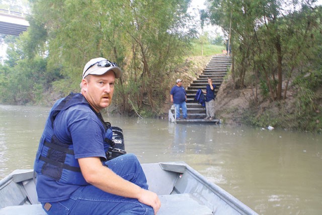 Into the wild: SARA employee Chris Svoboda hits the San Antonio River. - GREG HARMAN