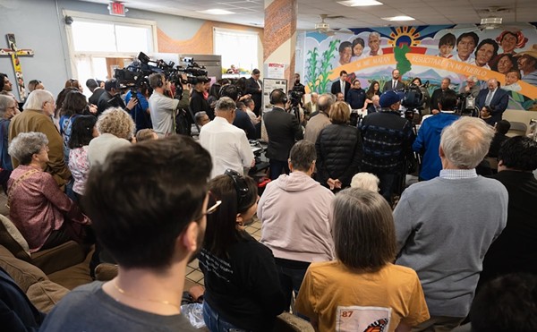 A crowd gathers a press conference at Annunciation House in El Paso on Feb. 23, 2024. Texas Attorney General Ken Paxton sued the migrant shelter, accusing it of operating a stash house and human trafficking. A judge on Tuesday ruled in favor of Annunciation House, which has been providing aid and shelter to migrants in El Paso for decades.