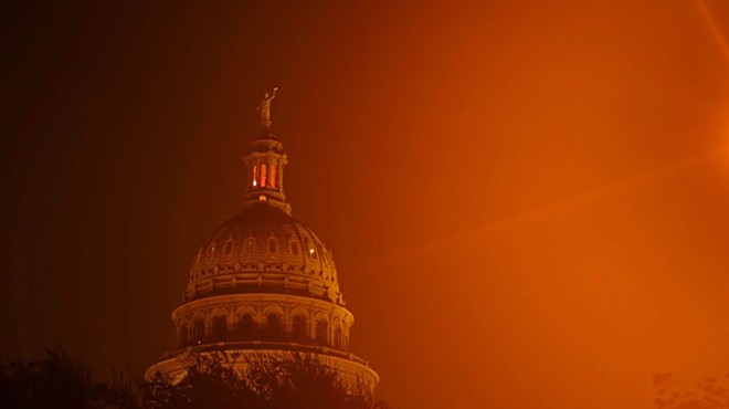 Streetlights illuminate the Texas Capitol through early morning fog on the ninth day of suspended Attorney General Ken Paxton’s impeachment trial in Austin on Sept. 15, 2023.
