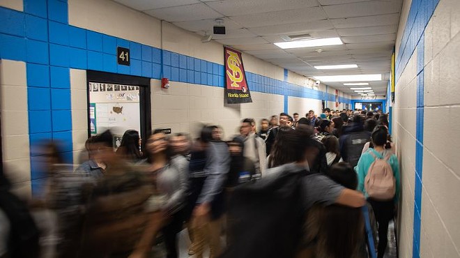 Students pass between classes at United South High School in Laredo.