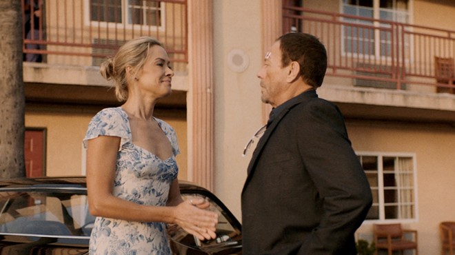 Kristanna Loken (left) shares a moment with Jean-Claude Van Damme in the new action-thriller Darkness of Man.