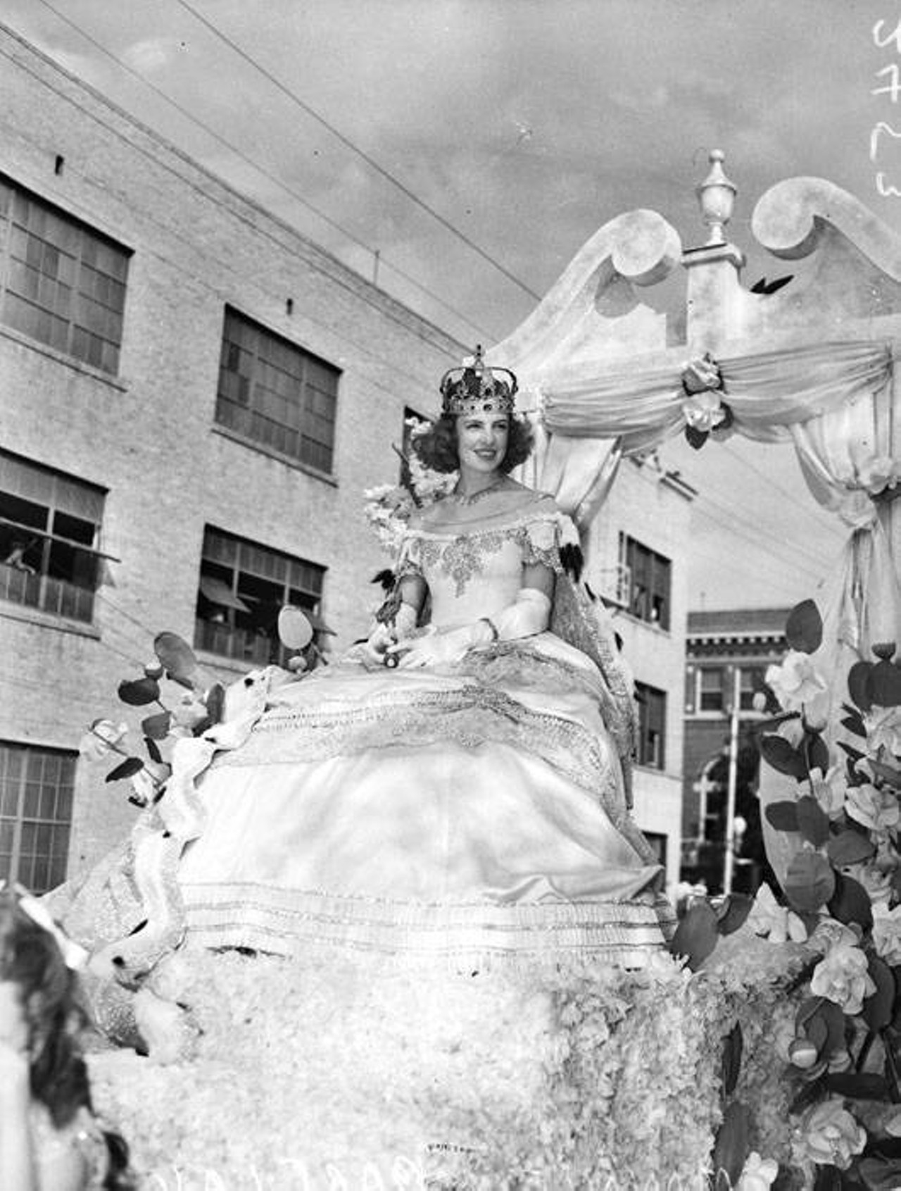 Margaret ''Monnie'' Barclay, Fiesta Queen
The Queen of the Court of the Old South rides upon her float in 1940.