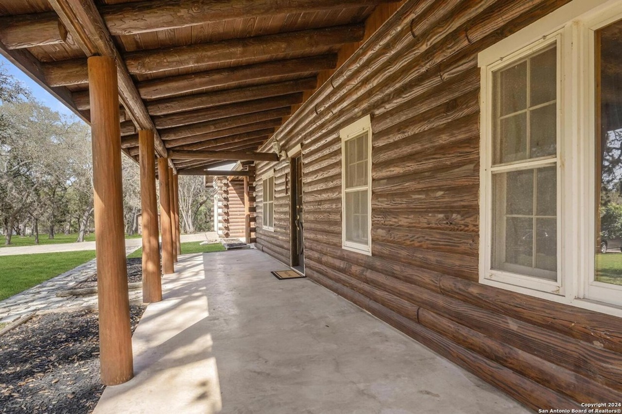 This San Antonio log cabin comes with a private creek and 10 acres of ...