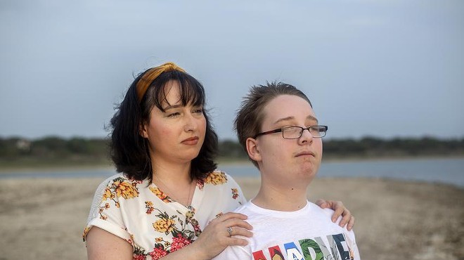 Trish and her 12-year-old son look out into the sunset at Canyon Lake on April 13, 2021. Trish earns too much to qualify for Medicaid in Texas but too little to afford her own health insurance. Her son does qualify for Medicaid.