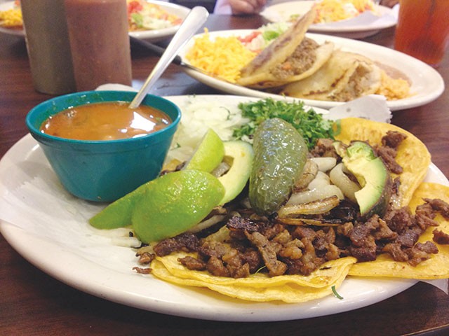Mini tacos with pastor meat, avocados, jalapeno, lime, onions and cilantro for $6.25 - JESSICA ELIZARRARAS