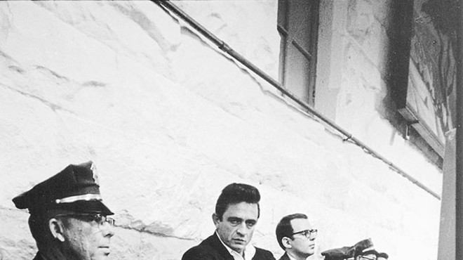 Cash at 1968’s historic Folsom Prison concert; to his left, Hilburn, the only music journalist present