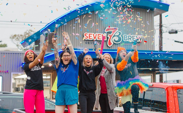 7 Brew coffee employees celebrate the grand opening of a new location.