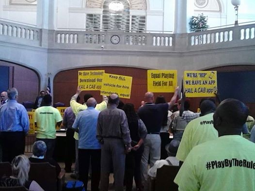 Opponents of the ride-sharing companies Uber and Lyft protested in City Council chambers earlier this year, prompting Public Safety Committee members to postpone moving rules that would allow the companies to operate in San Antonio to the full City Council while another task force studies proposed rules. - MARK REAGAN