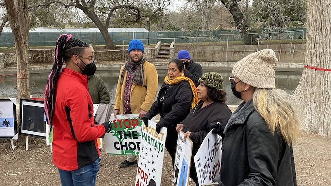 District 2 Councilman Jalen McKee-Rodriguez confers with activists before his news conference Wednesday in Brackenridge Park.