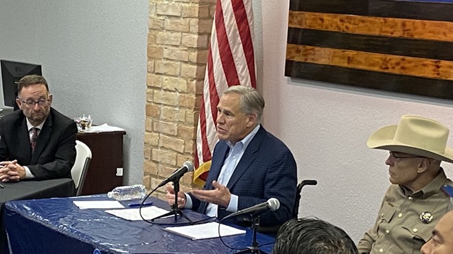Gov. Greg Abbott plays up his law and order credentials during Thursday's press conference in San Antonio.