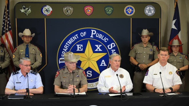 Gov. Greg Abbott surrounds himself with stern-looking men and women in uniform during one of his many recent immigration-related press conferences.