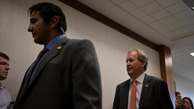 Texas Attorney General Ken Paxton enters the 185th Criminal District court at the Harris County Criminal Justice Center for a pretrial hearing Tuesday, March 26, 2024 in Houston.