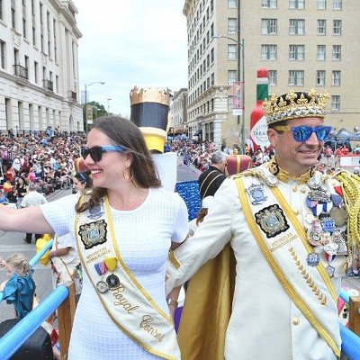 Kenneth "Ken" Flores (right) waves to the crowd during his time as Rey Feo LXX.