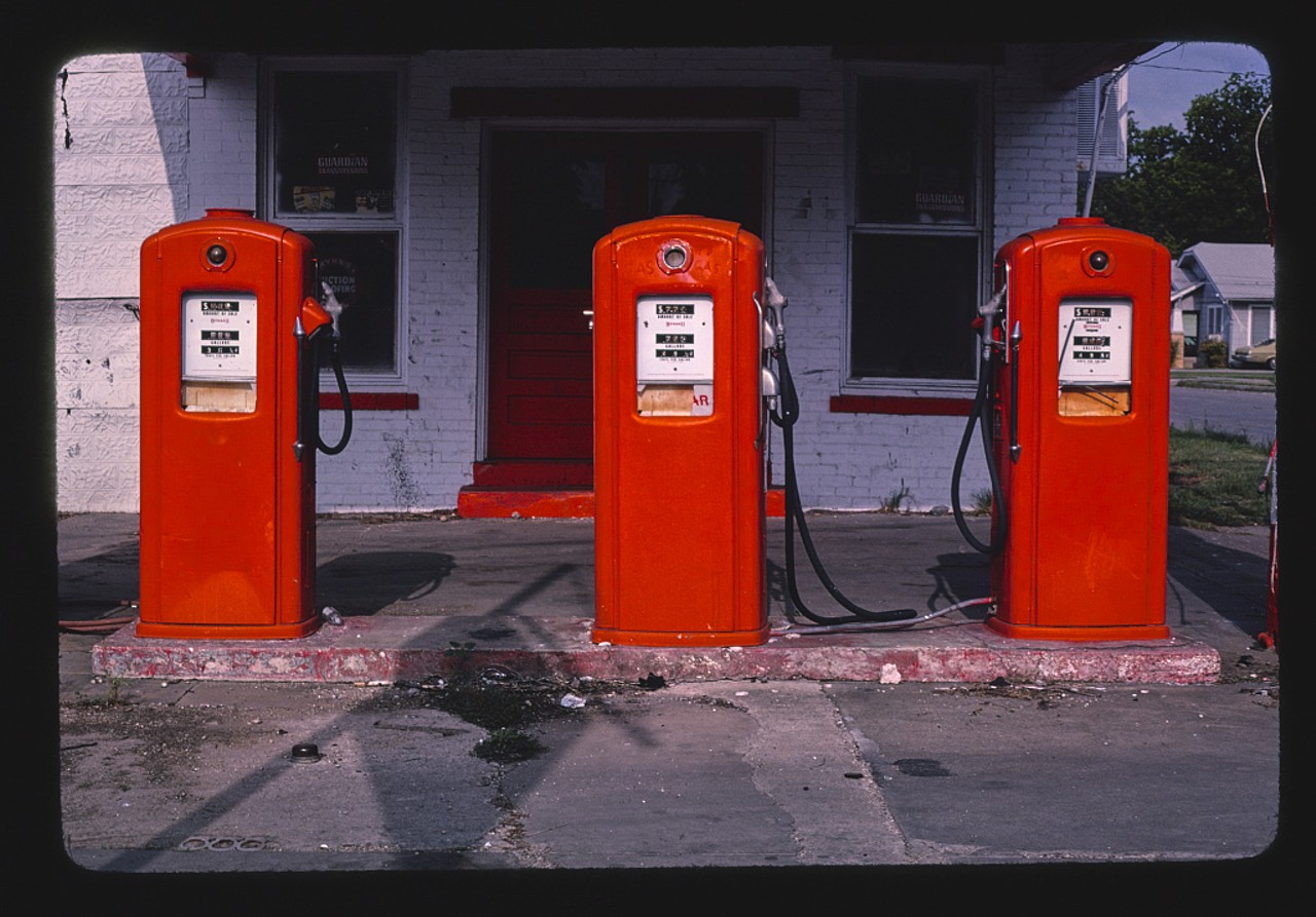 Three red gas pumps, South Flores Street, San Antonio, Texas