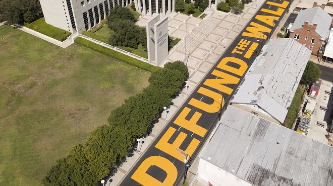 Laredo's "Defund the Wall" mural decorates the street in front of the border city's federal courthouse.