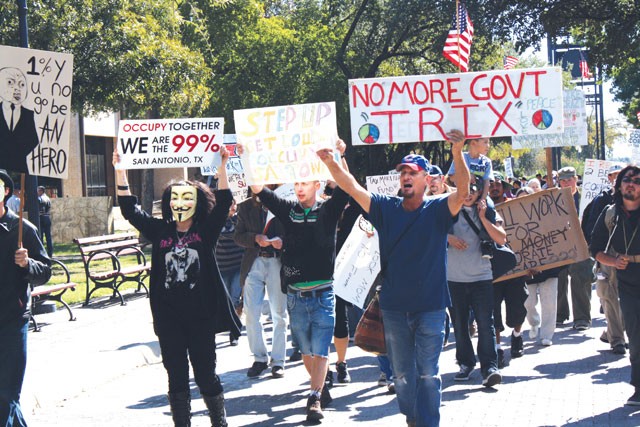 Occupy SA marchers at HemisFair Park in solidarity with an international call for a Robin Hood tax on bank transactions. - Greg Harman