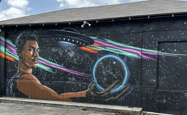 The new extraterrestrial-themed Wemby mural shows the French phenom holding the planet Earth.