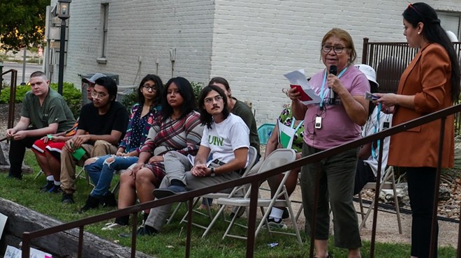 Soap Factory tenant Carmen Cruz tells her story during Monday's rally.