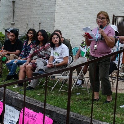 Soap Factory tenant Carmen Cruz tells her story during Monday's rally.