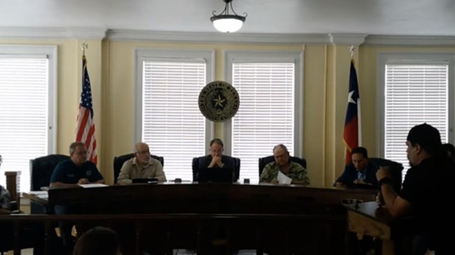 Brett Cross (right) speaks during a Uvalde County Commissioners meeting on Monday.