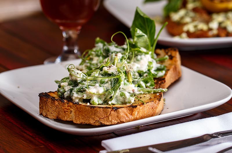 Peas, herbs and ricotta on toast from Folc - CASEY HOWELL