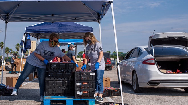 Volunteers unload pallets at a recent San Antonio Food Bank distribution.