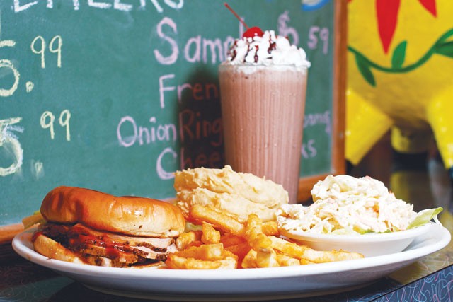 Pig sandwich, fries, onion rings, cole slaw and a chocolate shake from the Pig Stand. - STEVEN GILMORE