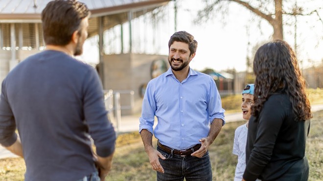 U.S. House candidate Greg Casar talks to potential voters.