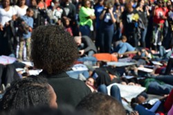Protests stage a die-in at the Martin Luther King, Jr. Day march in San Antonio on January 19, 2015. - ALBERT SALAZAR