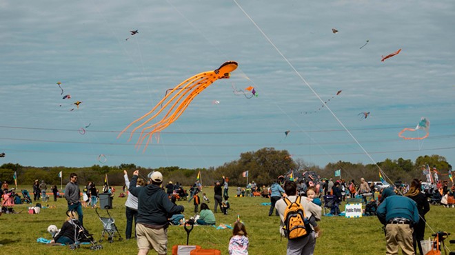 The annual event is centered on two tailed things: kites and dogs.