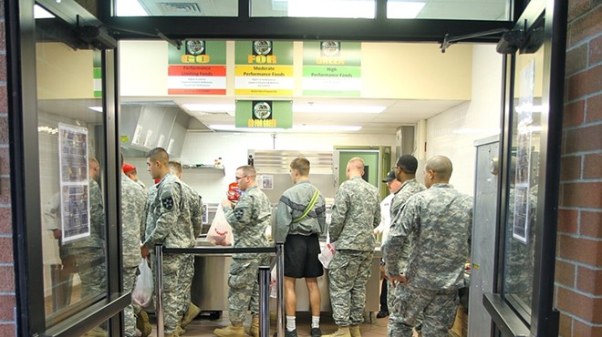 Soldiers stand in line at the Grab and Go section of the Cannon and Castle Grill Dining Facility at Joint Base Lewis-McChord, Wash.