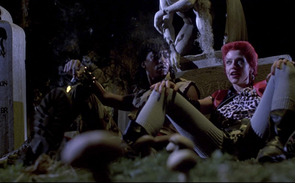 Miguel Nunez and Linnea Quigley share a scene in the graveyard in 1985's Return of the Living Dead.