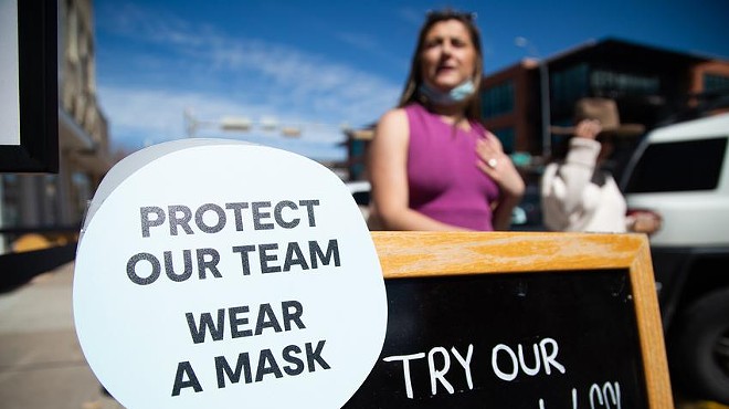A sign in South Austin asks customers to wear a mask inside a business on March 3, 2021.