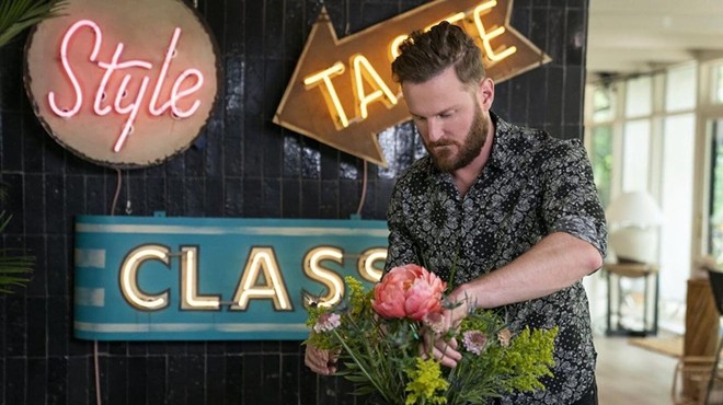 Queer Eye star Bobby Berk lends his stylistic touch to a flower arrangement.