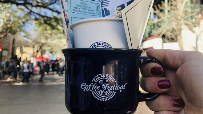 A San Antonio Coffee Festival attendee shows off their swag from the 2020 event.