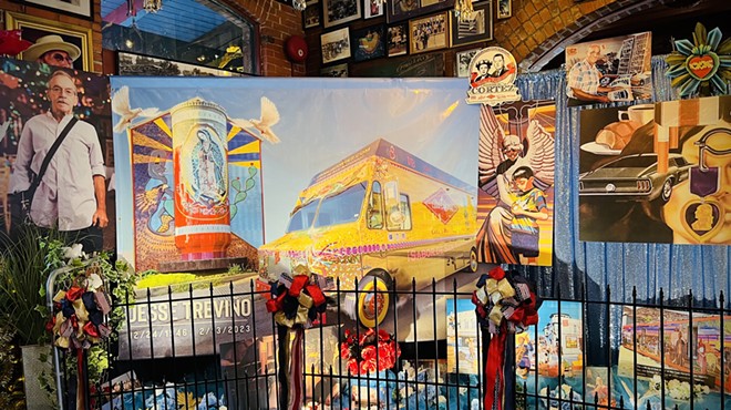 An altar to Jesse Treviño at Mi Tierra includes images of some of his best-known work.