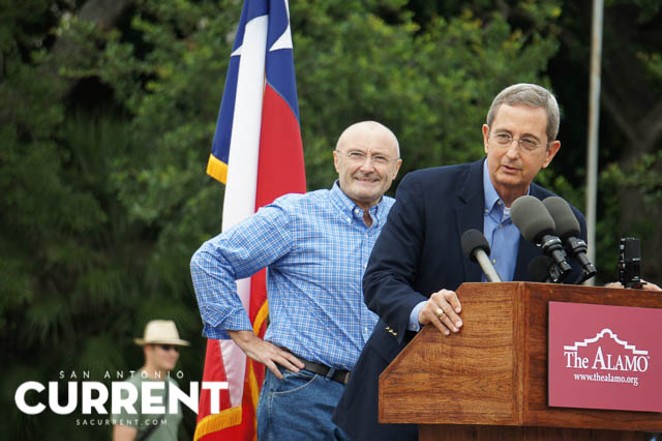 Phil Collins is joined onstage by Texas Land Commissioner Jerry Patterson in front of the Alamo on June 26, 2014. - ALBERT SALAZAR
