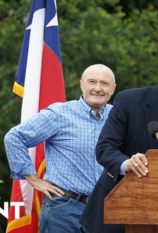 Phil Collins is joined onstage by Texas Land Commissioner Jerry Patterson in front of the Alamo on June 26, 2014.