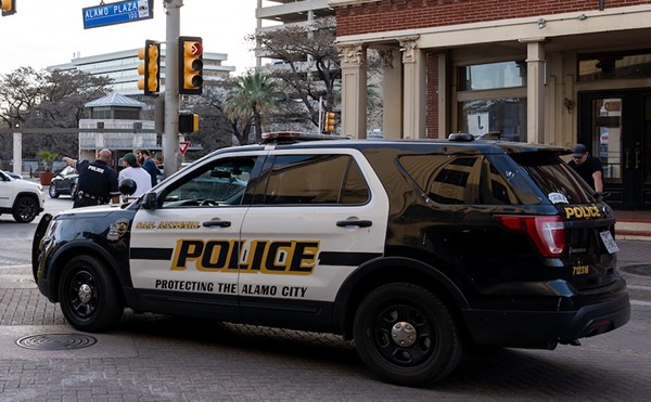 A San Antonio Police Department vehicle parks on a downtown street.